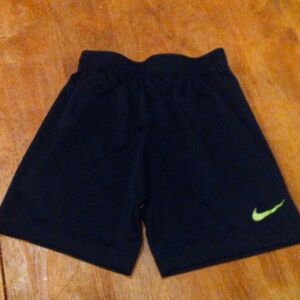 A pair of kids Nike sweatshirts